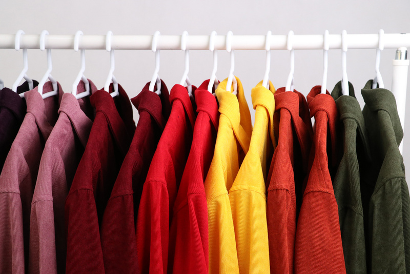 Colorful Clothes Hanging on a Clothing Rack